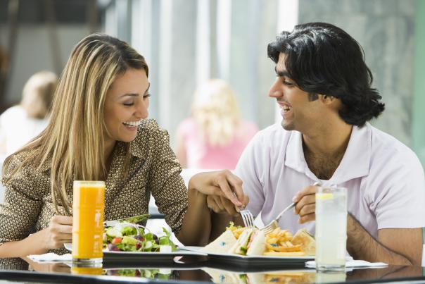 A hispanic couple enjoying a meal