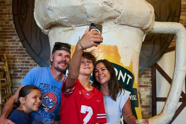 A family taking a selfie at Lakefront Brewery.