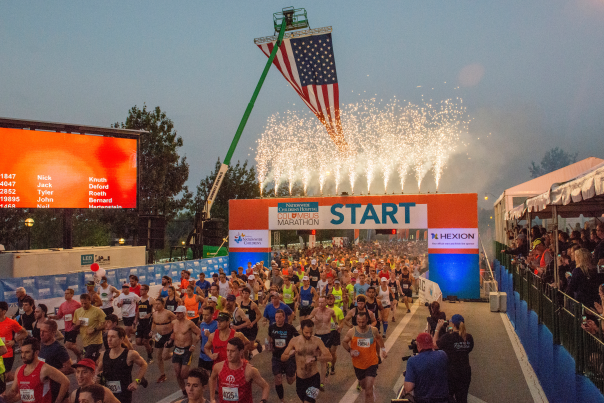 Runners taking off from starting line during Columbus Marathon