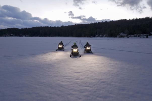 Aerial photo of snowmobilers on Loon Lake