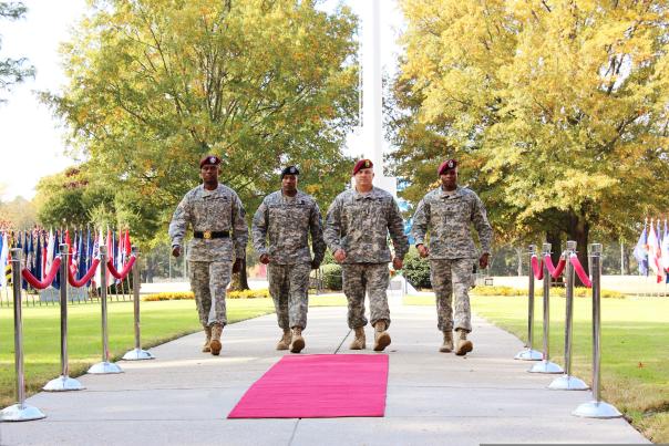 Four US military soldiers walking together