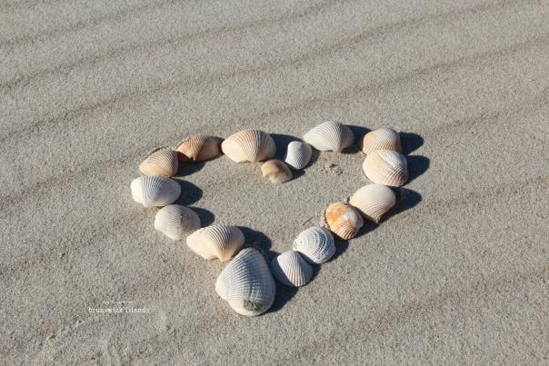 A heart made of shells on the beach in NC's Brunswick Islands