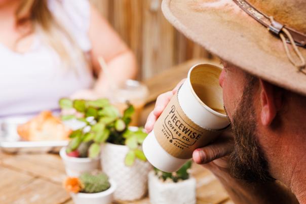 People drinking coffee on a patio