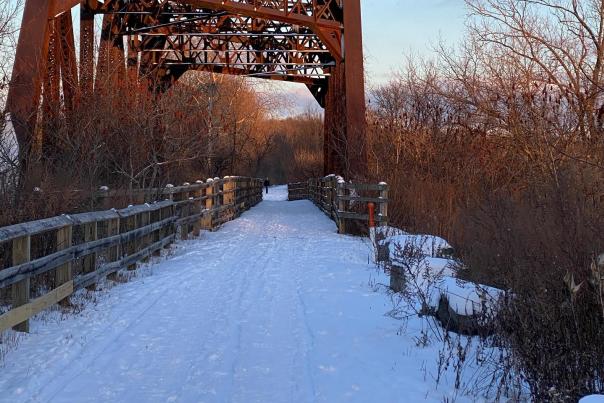 A snowy trail runs along the path of an old train line in Lehigh Valley, Pa.