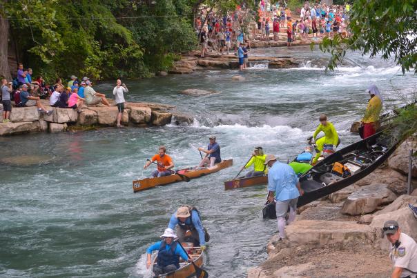 Texas Water Safari kayak racers portage at Rio Vista Falls