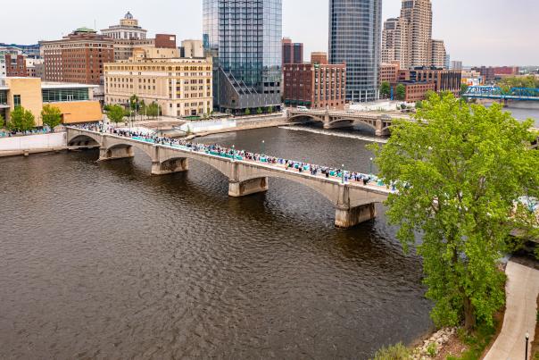 Drone photos of an outdoor event at DeVos Place and the Gillette Bridge near the Grand River in downtown Grand Rapids.