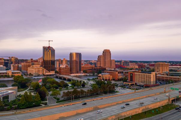 The Grand Rapids downtown skyline sparkles in sunlight in the aerial view.