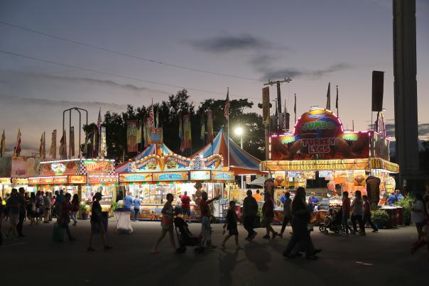 People walking past food vendors at the Oklahoma State Fair