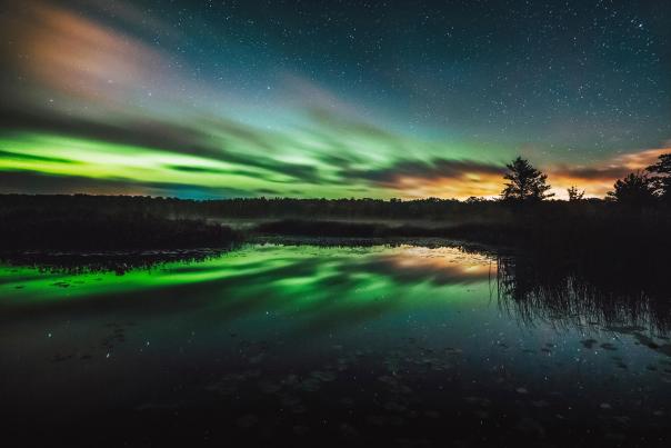 Green Auroras over the sky in Big Bay, MI