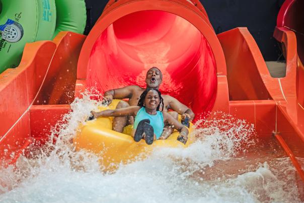 A grandfather and granddaughter enjoy one of the slides at Kalahari Resort in the Poconos.