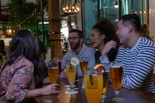 Friends enjoy a night out together at Toronto's Steam Whistle Brewery