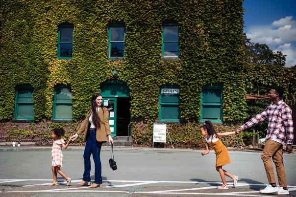A family walks along through the small town of Hawley, PA in the Pocono Mountains.
