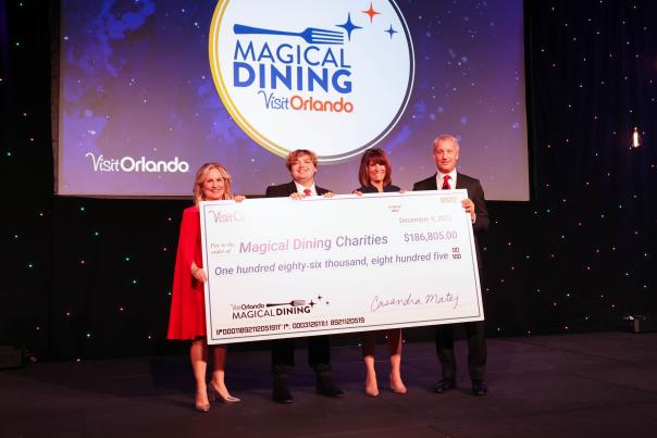 Magical Dining check presentation to the Able Trust charity at the Visit Orlando Year-End member luncheon on December 9, 2022.