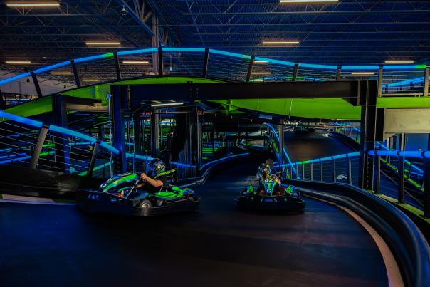 Go karts on an indoor track at Andretti Indoor Karting & Games