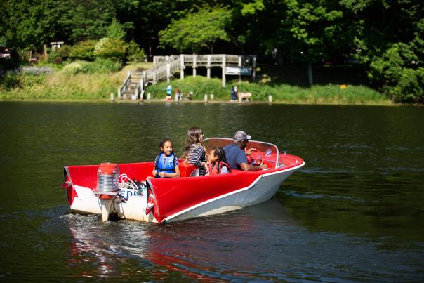 Enjoying the lake in a retro boat.