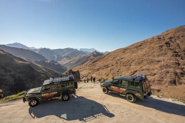 Group with two cars parked at Lighthouse Point on the Skippers Road Queenstown