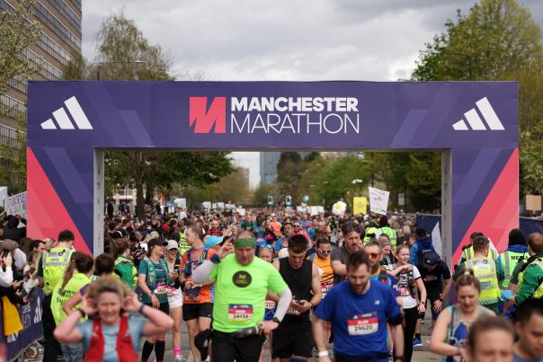 Runners at the finish line of the Manchester Marathon