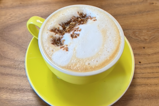 Coffee is a yellow mug on a yellow plate