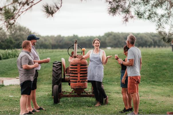 group enjoying tea by tractor