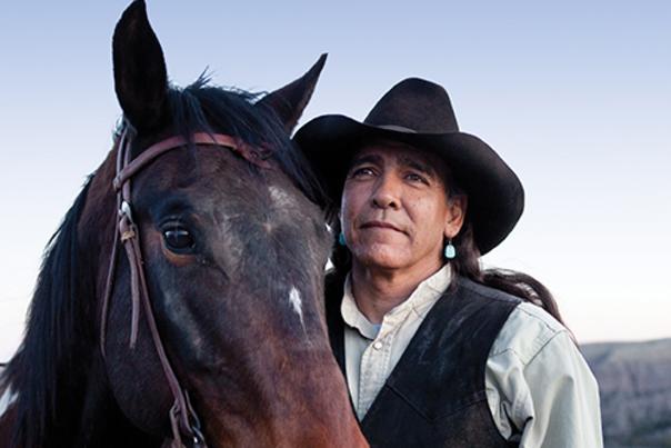 Joe Saenz, the top guide in Southern New Mexico, holds a loose rein on one of the horses he raised from a colt.