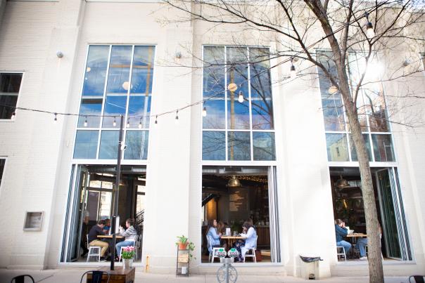Couples dine in an open-air restaurant in Madison