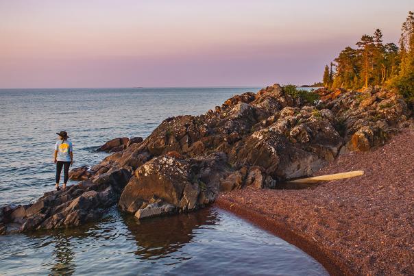 A rocky beach at sunset in Copper Harbor, located in the Upper Peninsula of Michigan
