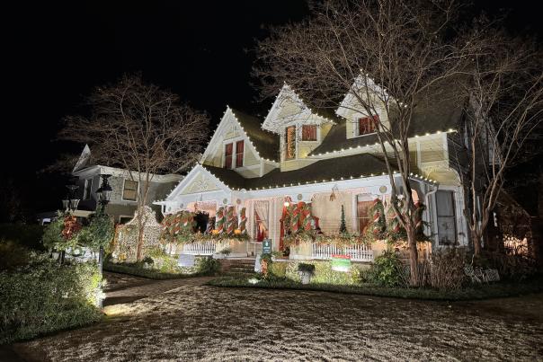 A house is all lit up and decorated for the holiday season.