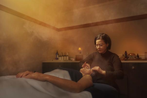 Woman enjoying a relaxing spa facial at Willowbrook Spa in Canandaigua, New York.