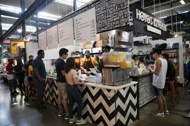 People Standing In Line At Hoyo's Kithcen, Somali Restaurant, North Market