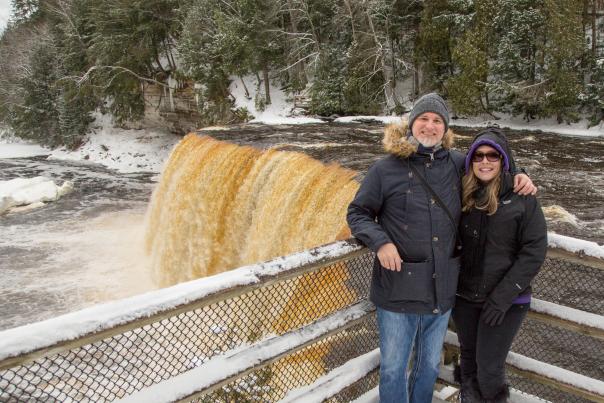 A couple at Tahquamenon Falls, located in the Upper Peninsula of Michigan, USA