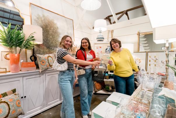 Women enjoying a shopping trip at Miss Lucille's.
