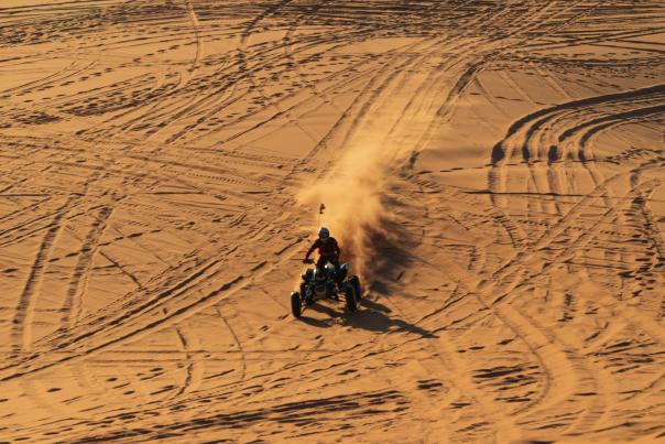 Person at the Coral Pink Sand Dunes near Kanab on an ATV