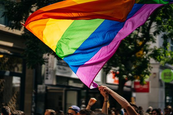 LGTBQ Flag waving in the air