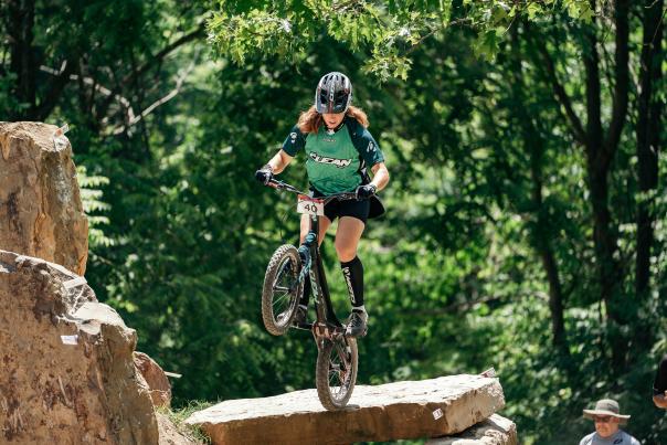 Rider performs bike trials on rocky terrain at the annual Bike Fest in Bentonville.