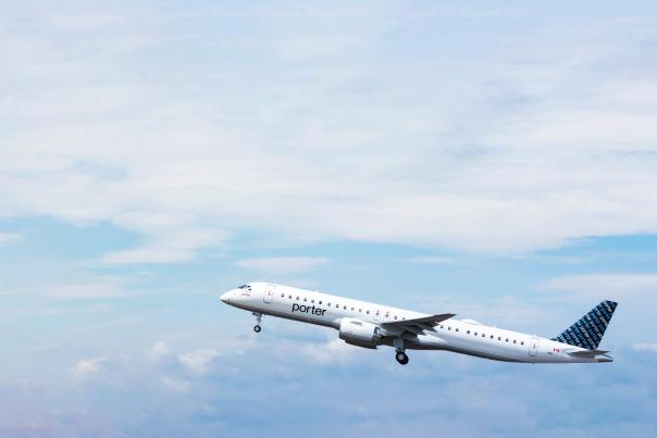 Porter Airlines airplane flying in the sky.