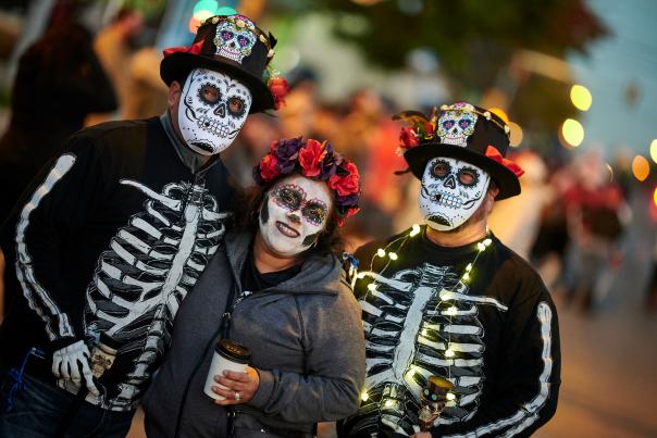 Friends enjoy the Day of the Dead Parade in KCK