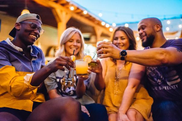 A group of friends enjoy a night out with drinks in Baton Rouge, LA