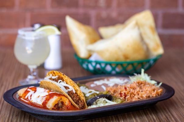 The Monday Tamale Blue Plate includes a pork tamale with red chile, a blue-corn cheese enchilada with green chile, and a beef taco.