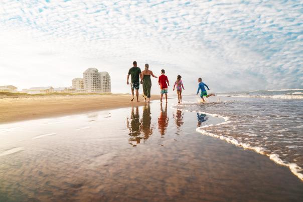Family walking on the beach