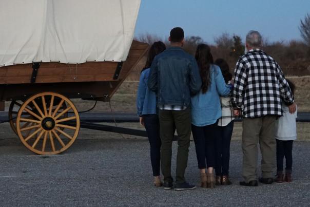 Family staying in Conestoga Wagons at Orr Family Farm