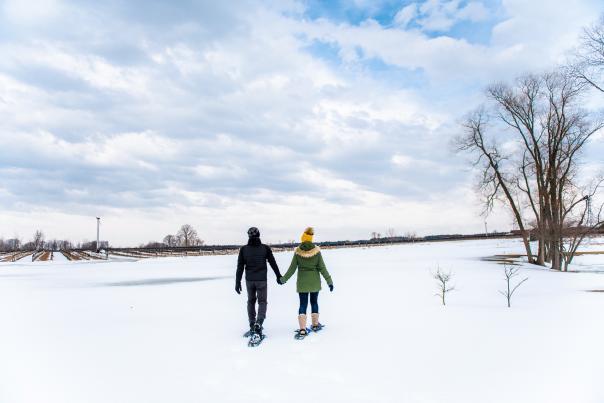 two people walking in snow