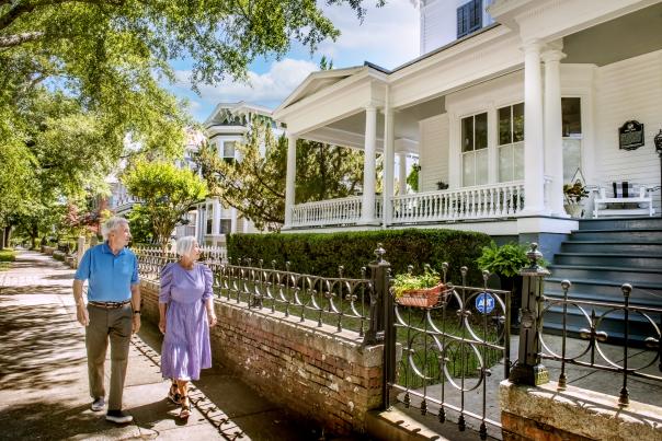 Couple walking past historic homes in downtown Wilmington