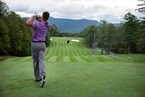 Man Teeing Off at the Golf Course