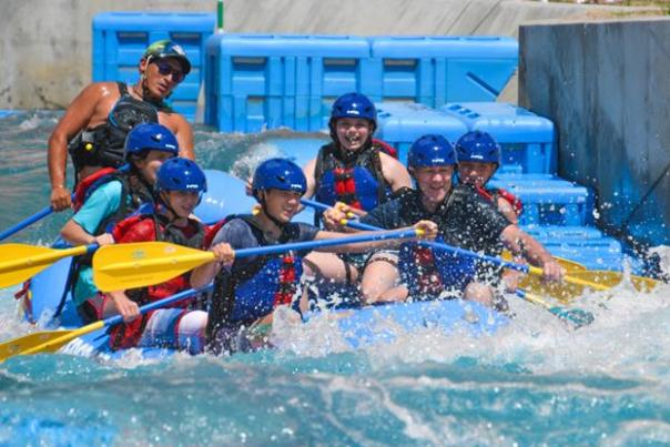 A group white water rafting at Riversport Rapids