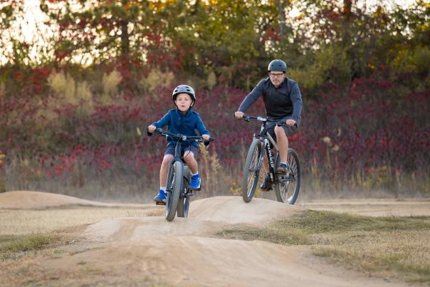 Father and son biking at Carver Lake Bike Trail.