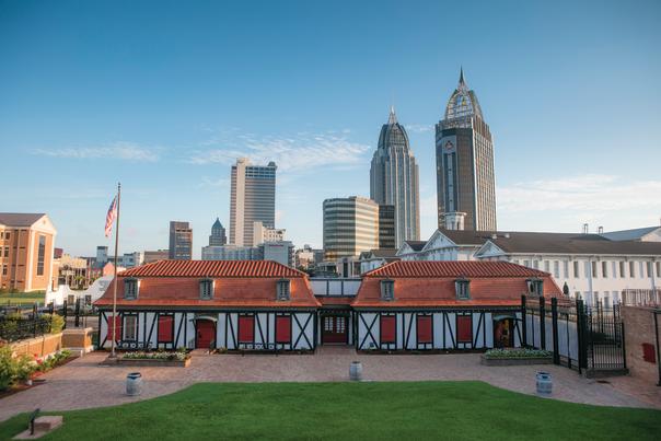 historic fort with high rise buildings in the background