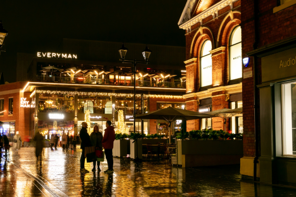 Image shows people enjoying late night shopping in Lincoln, as the city is illuminated with Christmas lights