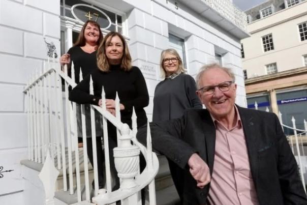 Image shows 1 male and 3 females from the Neptune Apartments team