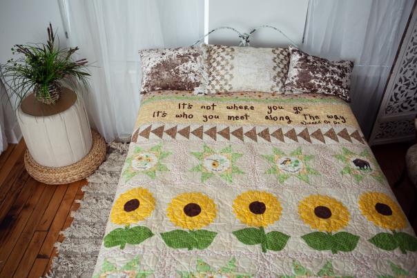 A bedroom quilt with the exclusive pattern participants in the All Kansas-Nebraska Shop Hop can find