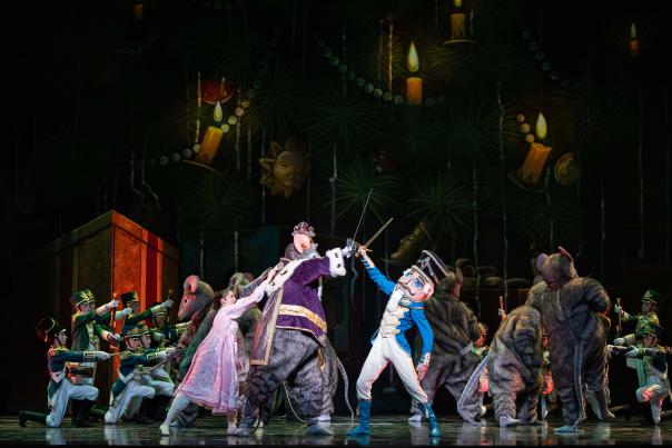 On-stage performance of the Nutcracker ballet with Clara and the Nutcracker and the Rat King fighting